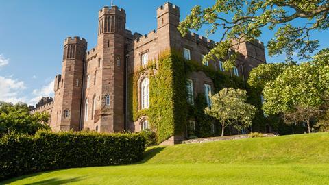 An exterior shot of Scone Palace on a bright sunny day